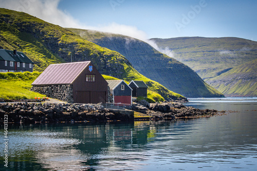 fishing huts in vestmanna village,  streymoy island, faroe islands, north atlantic, europe photo