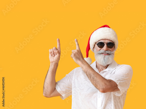 Cool senior man in Santa ha...