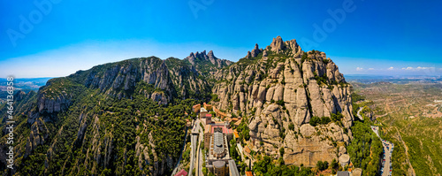 The aerial view of Santa Maria de Montserrat, an abbey of the Order of Saint Benedict located on the mountain of Montserrat in Monistrol de Montserrat, Catalonia, Spain