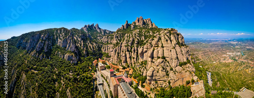 The aerial view of Santa Maria de Montserrat, an abbey of the Order of Saint Benedict located on the mountain of Montserrat in Monistrol de Montserrat, Catalonia, Spain