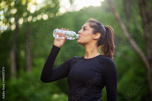 Fit woman drink water outdoor