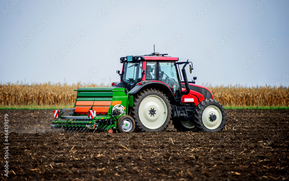 Sowing time. Farmer working in the field with a tractor. Agricultural concept Sowing time. Farmer working in the field with a tractor. Agricultural concept