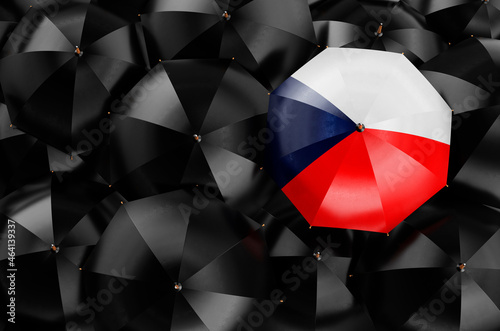 Umbrella with Czech flag among black umbrellas, 3D rendering