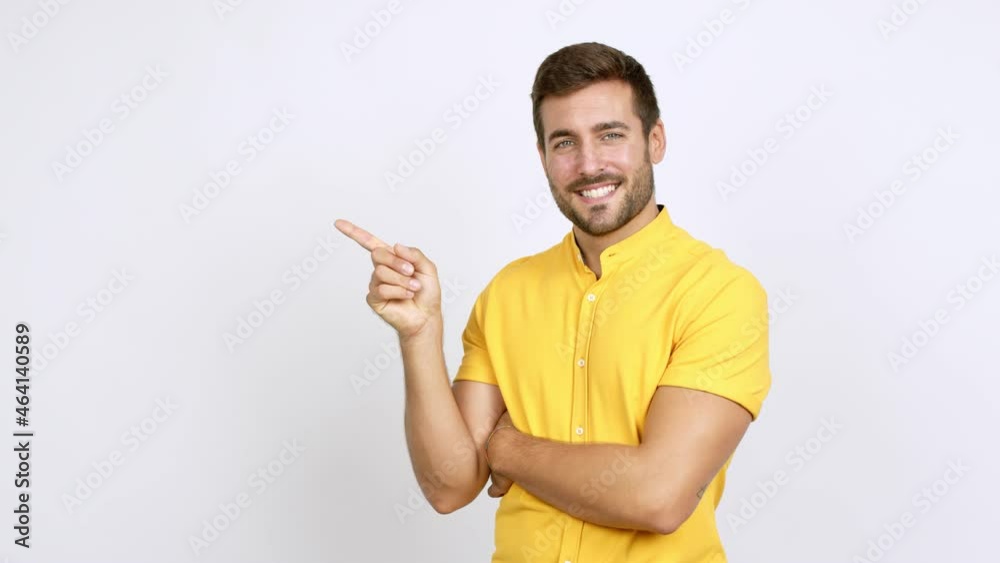 Handsome man pointing finger to the side and presenting a product over isolated background Handsome man pointing finger to the side and presenting a product over isolated background