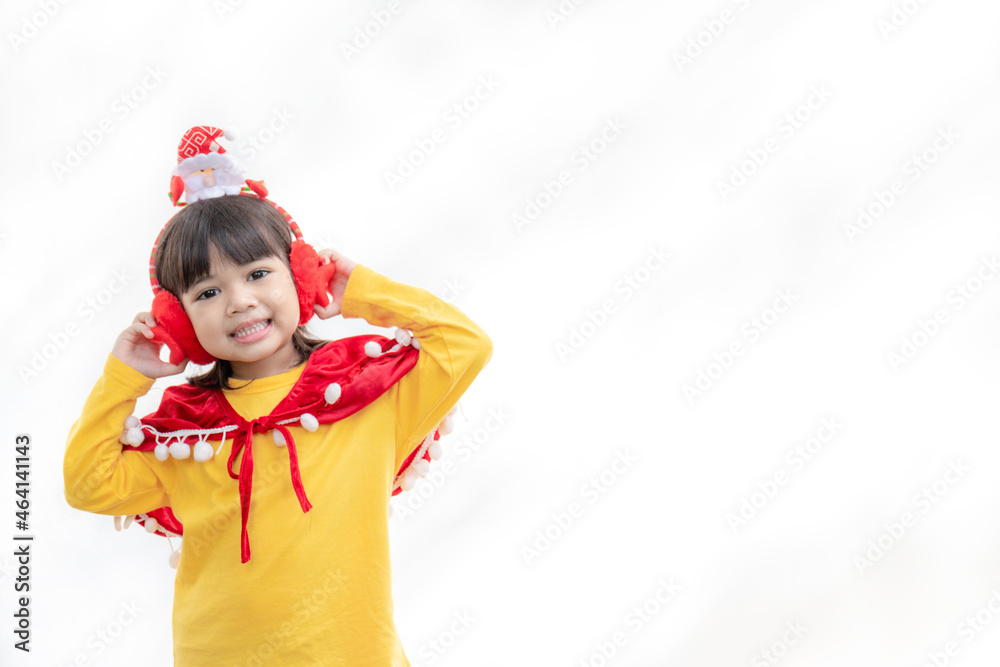 Asian little girl in red santa hat on white background. Asian little girl in red santa hat on white background.