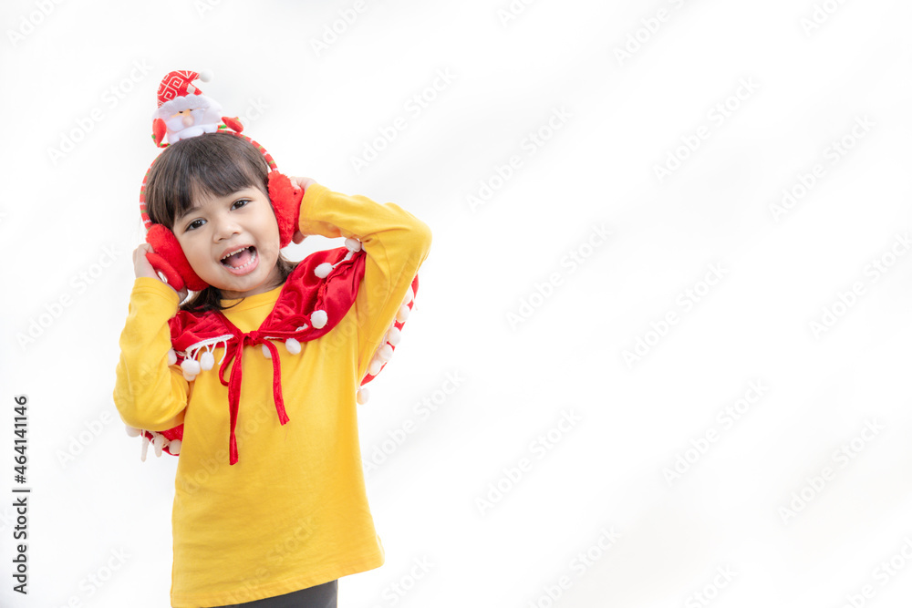 Asian little girl in red santa hat on white background. Asian little girl in red santa hat on white background.