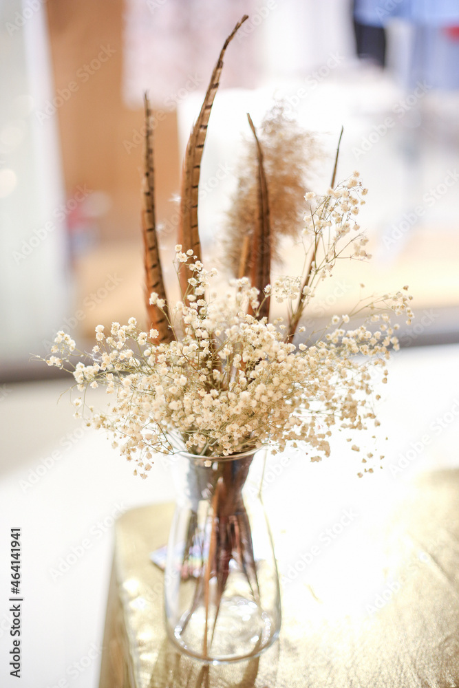 white dried flowers in a vase. beautiful artificial flowers.