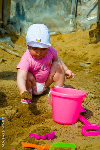 little child playing with sand © Anastasia