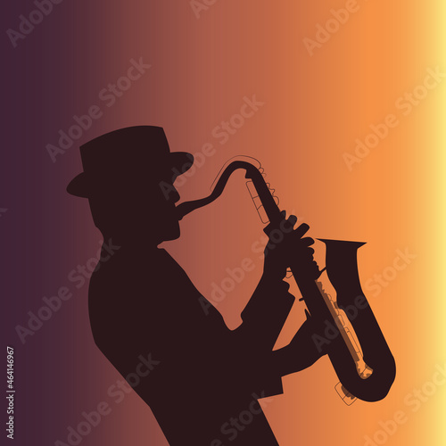 a man playing the saxophone at sunset