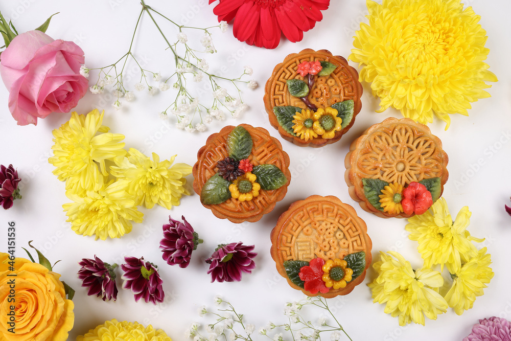 Colorful flower decorated moon cake Chinese mid autumn festival daisy chrysanthemum mum rose baby breath flower red yellow pink purple violet on white background