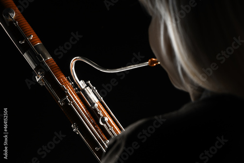 Bassoon orchestra player. Woodwind music instruments photo
