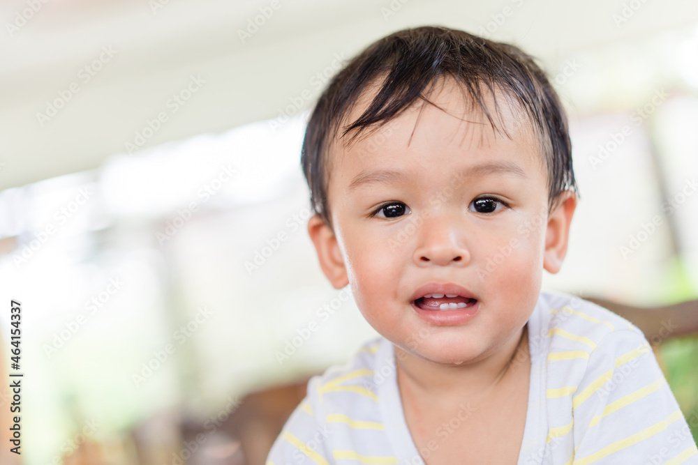 Happy asian boy child showing front teeth with smile and laughing : Healthy happy funny smile baby infant kid.Adorable toddler mixed race kid.portrait asian boy.dental healthcare.milk teeth.handsome.