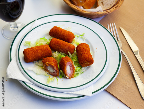 Spanish flamenquines, breaded pork loin rolled with serrano ham, typical of Andalusia photo