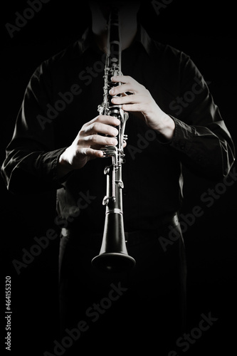Clarinet player. Clarinetist hands playing woodwind music instrument close up