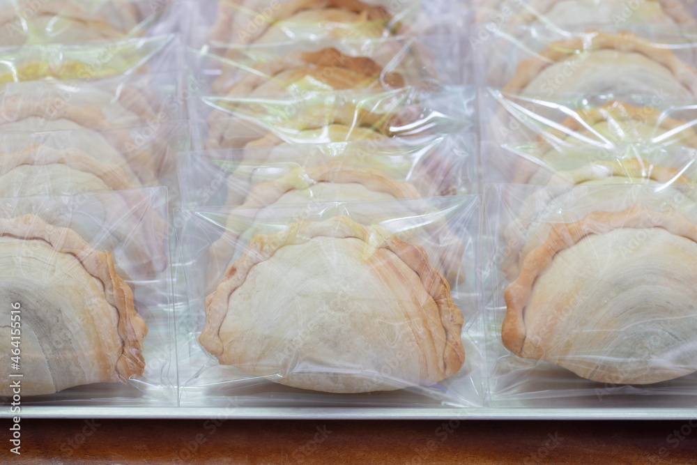Curry puffs in plastic bag package with close up shot. Curry puffs in plastic bag package with close up shot.