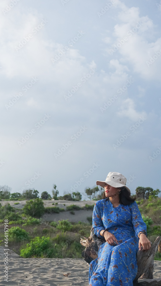 20 october 2021 photo of a female model taking pictures in the sand dunes area in yogyakarta indonesia