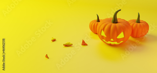 3D rendering. Jack's lamp from an orange pumpkin with a green tail for Halloween on a yellow background and two more pumpkins with pieces. View from above.
