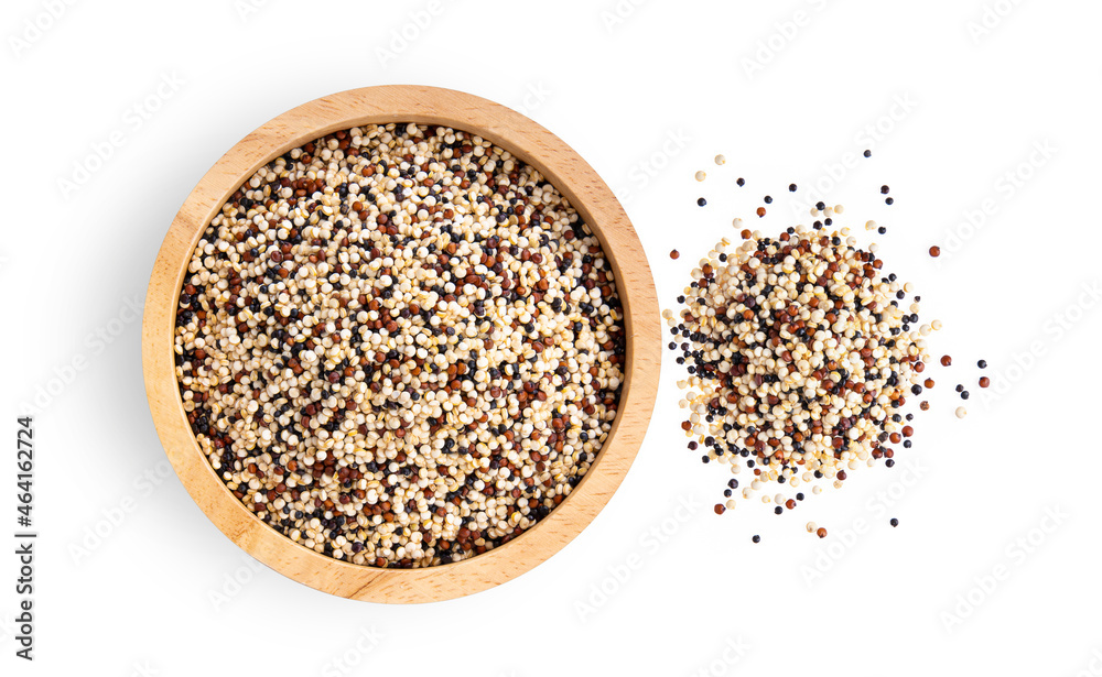 Pile of mixed raw quinoa in wood bowl isolated on white background Pile of mixed raw quinoa in wood bowl isolated on white background