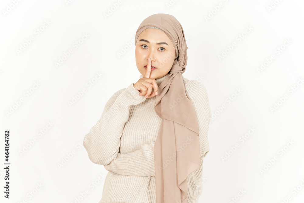 Shh Be Quiet of Beautiful Asian Woman Wearing Hijab Isolated On White Background Shh Be Quiet of Beautiful Asian Woman Wearing Hijab Isolated On White Background