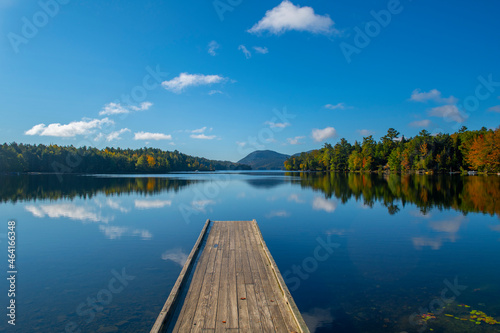 landscape of pier on the quiet lake in autumn