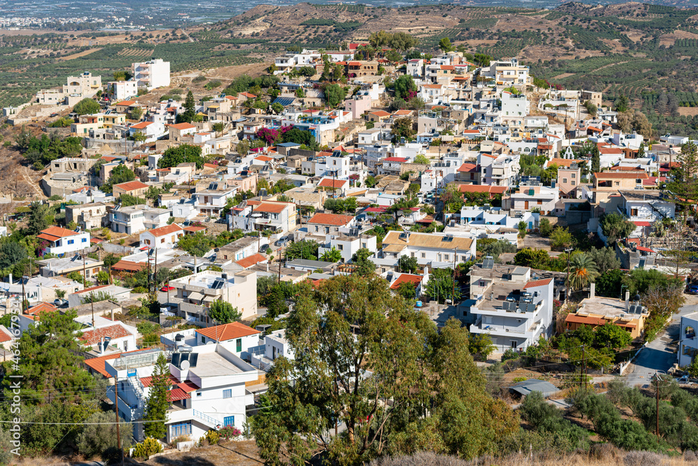 View down to the picturesque village Kamilari. Located in the south of Crete, near Phaistos and the mediterranean sea, the village is a popular tourist destination