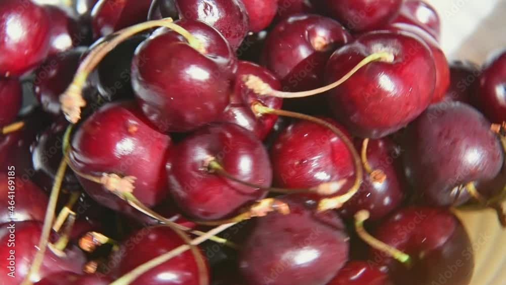 Rotation of fresh juicy wet red cherry, close up. Rotation of fresh juicy wet red cherry, close up.