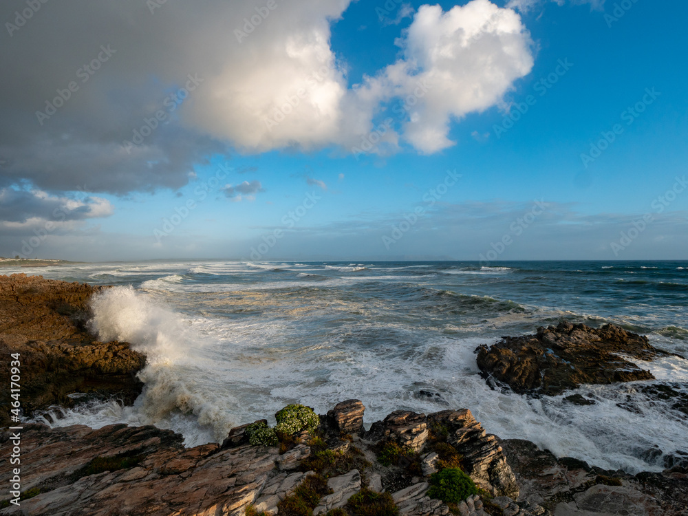 Large ocean swells crashing into rocky shoreline at Siever's Point. Hermanus. Whale Coast. Overberg. Western Cape. South Africa