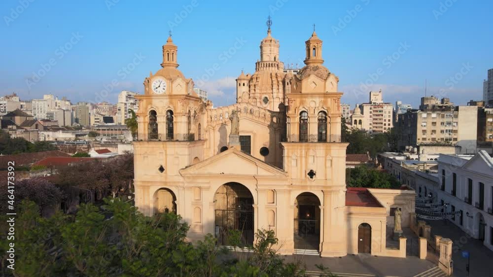 Cinematic aerial dolly in shot toward the statue of Christ in between two clock towers, historic monument Cathedral of Cordoba, Argentina. Cinematic aerial dolly in shot toward the statue of Christ in between two clock towers, historic monument Cathedral of Cordoba, Argentina.