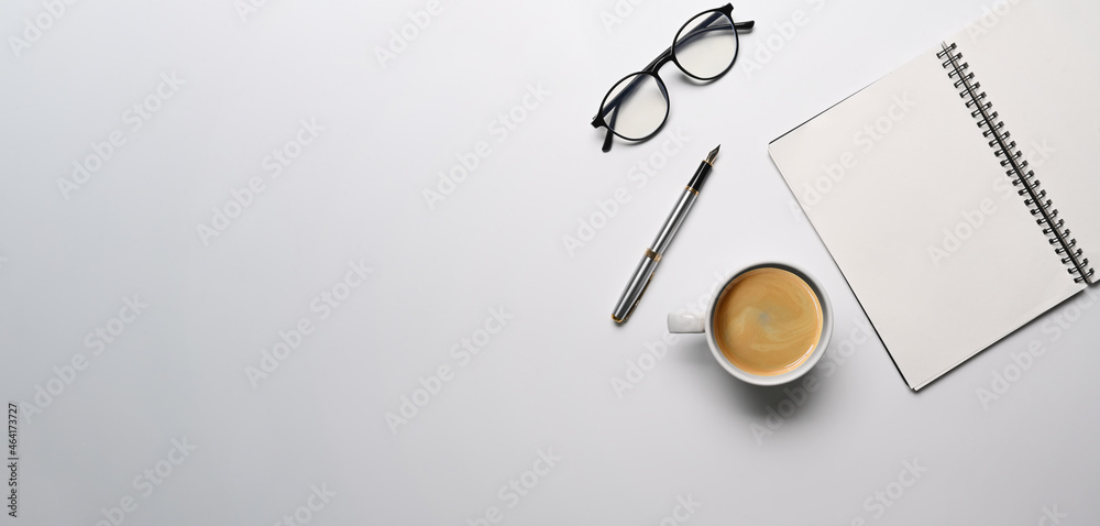 Top view empty notebook, eyeglasses and coffee cup on white background. Top view empty notebook, eyeglasses and coffee cup on white background.