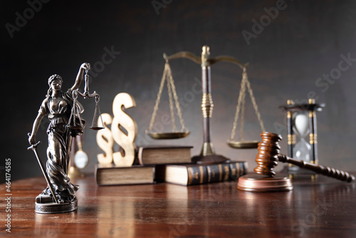 Lawyer office. Law symbols composition: judge’s gavel, Themis sculpture, paragraph sign and scale.