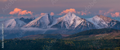 Fototapeta Naklejka Na Ścianę i Meble -  View on snow-capped mountain peaks in a beautiful, dramatic morning. Tatra Mountain, Slovakia