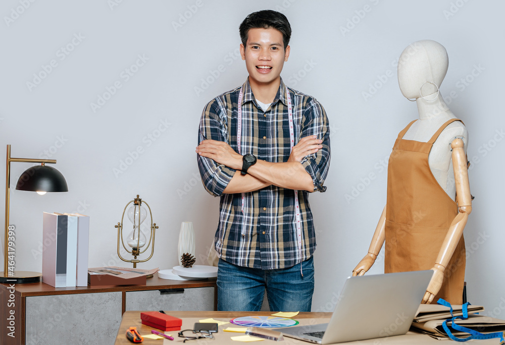 Young male designer use laptop computer while working Young male designer use laptop computer while working