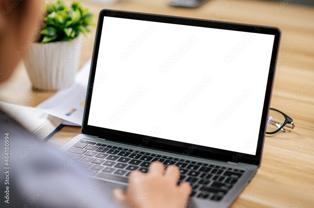 Young woman working with laptop computer on desk Young woman working with laptop computer on desk
