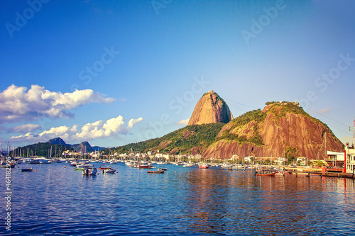 Berth, port with boats, shallops and Urku mountains and Sugar Loaf. Guanabara Bay, a creek on the shores of the Atlantic Ocean. Brasilia, Rio de Janeiro photo