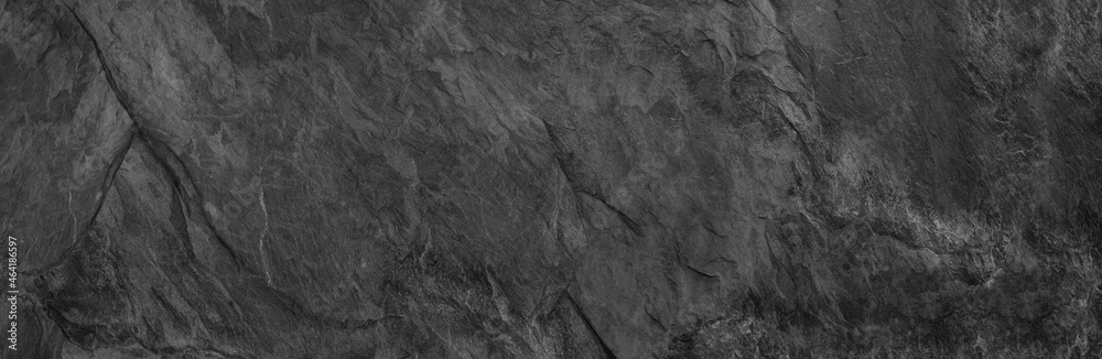 Gray grunge banner. Abstract stone background. The texture of the stone wall. Close-up. Gray grunge banner. Abstract stone background. The texture of the stone wall. Close-up.