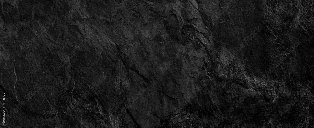 Naklejka premium Panorama dark gray stone background with copy space. Black grunge banner with rock texture.