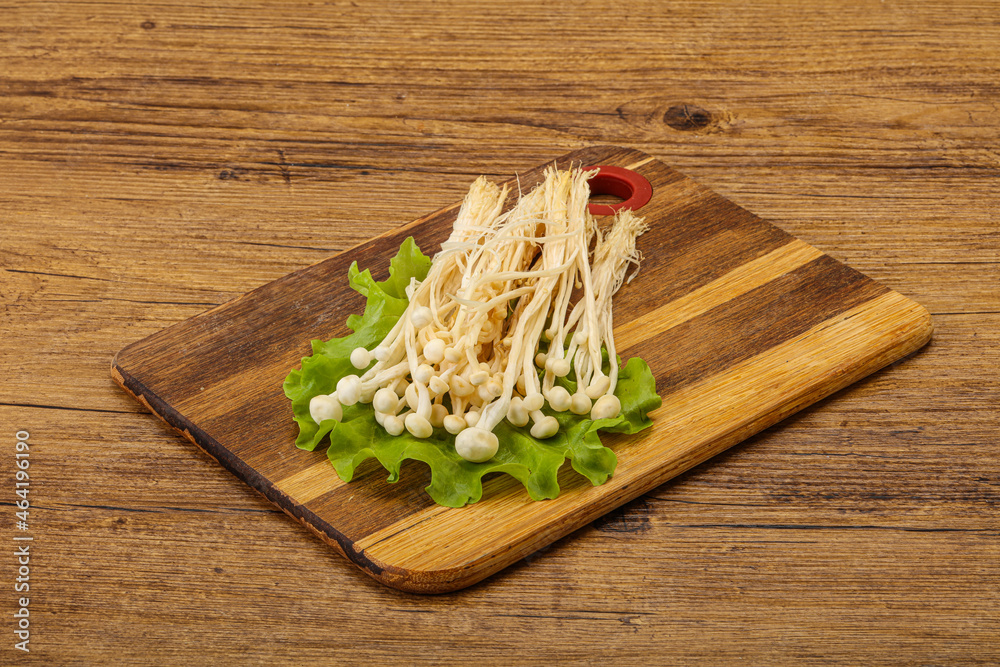 Raw Enoki mushrooms for cooking Raw Enoki mushrooms for cooking