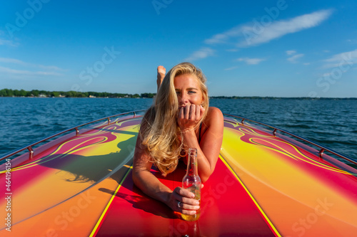 Beautiful Bikini Model Relaxing On A Boat photo