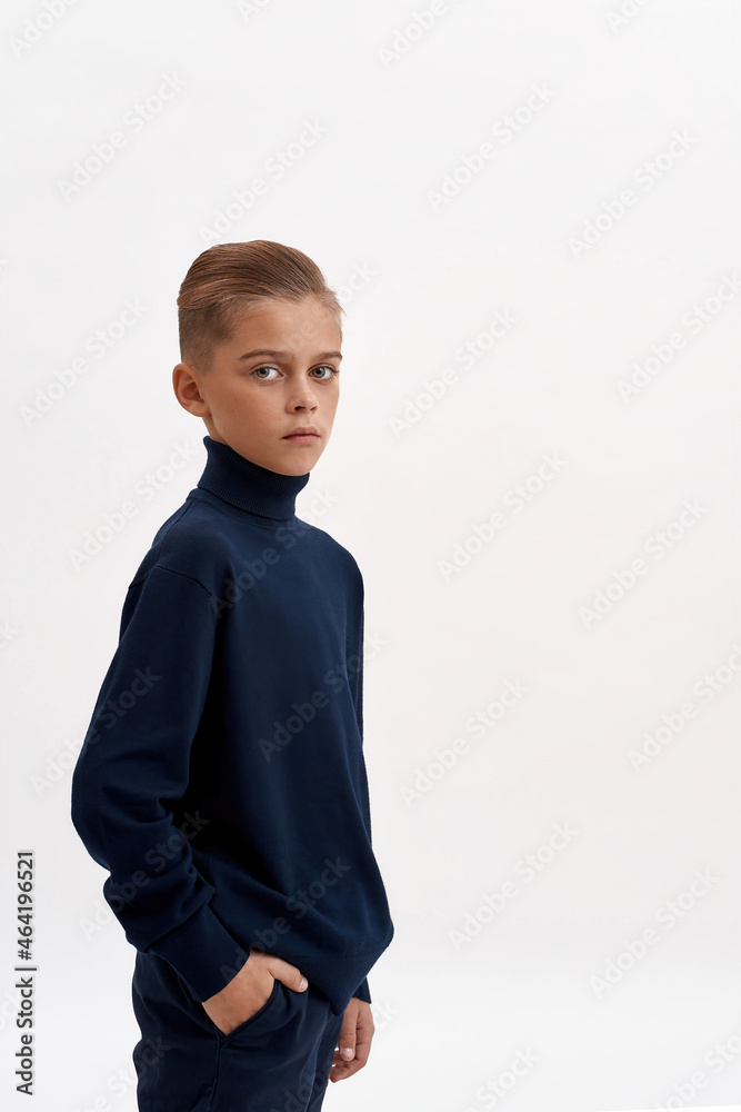 Narrow shot of small boy child on white background