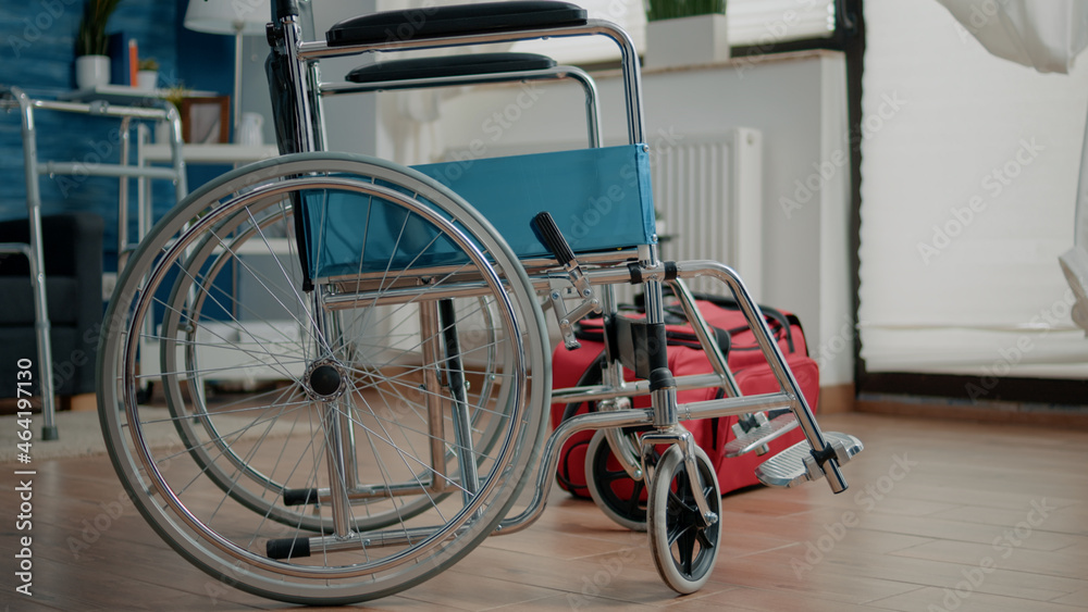 Nobody in nursing home room with transportation support for patients. Empty space with wheelchair and walk frame for medical assistance, healthcare and rehabilitation