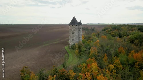 a an old caslte tower in the woods.