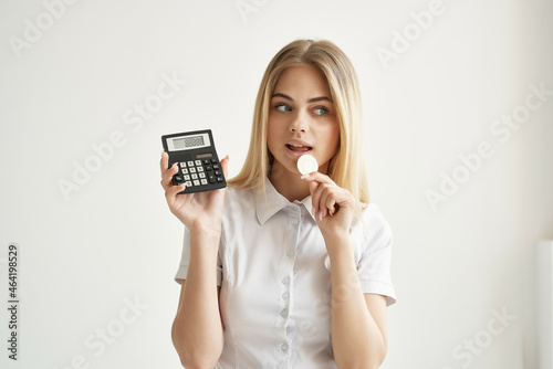 Businesswoman in a white shirt with a folder in hand light background