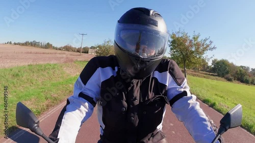 a motorcyle men perspective in summer on the road