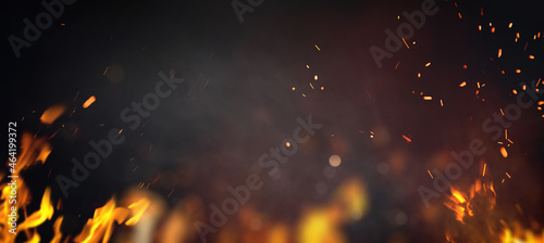 Halloween Witch .  Fire embers particles over black background. Fire sparks background. Abstract dark glitter fire particles lights.