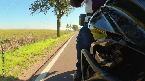 a motorcyle wheel perspective in summer on the road