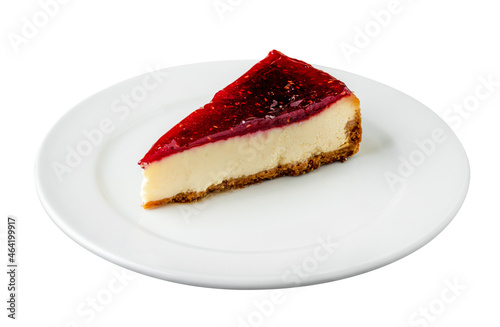 Raspberry cheesecake with brewing coffee on black stone table