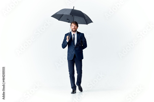 business man in a suit manager office work umbrella in hand