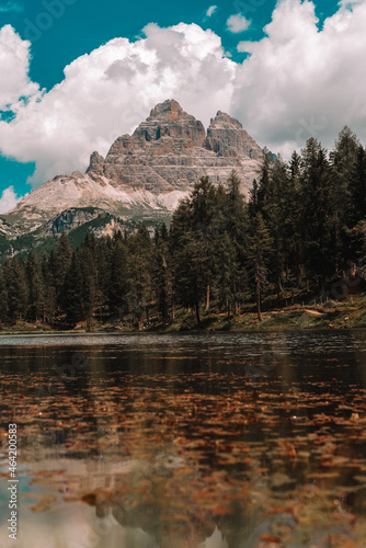 Lake and a Dolomites mountain top in background, South Tyrol, Italy.
