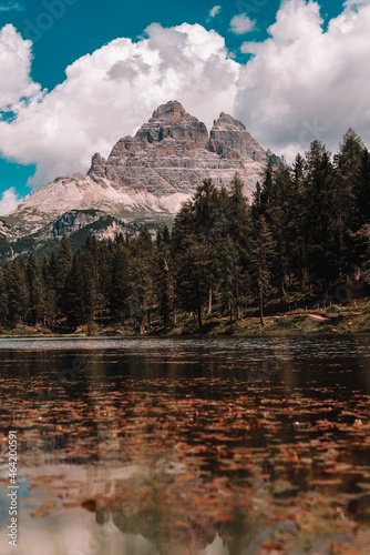 Lake and a Dolomites mountain top in background, South Tyrol, Italy.