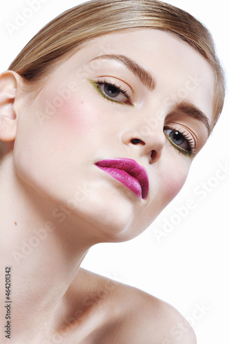 Beautiful girl with perfect healthy skin of face, hairstyle and pink lips
